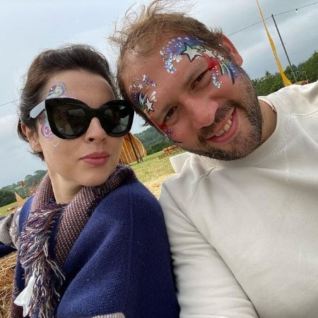 Picture of Matilda Sturridge with her Husband, Ollie Rosenblatt in blue sweeter with a different looks.